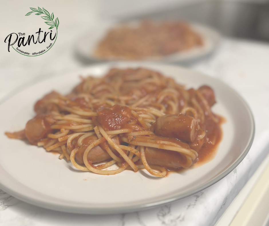 Photo of hotdog spaghetti on plates in a tomato sauce